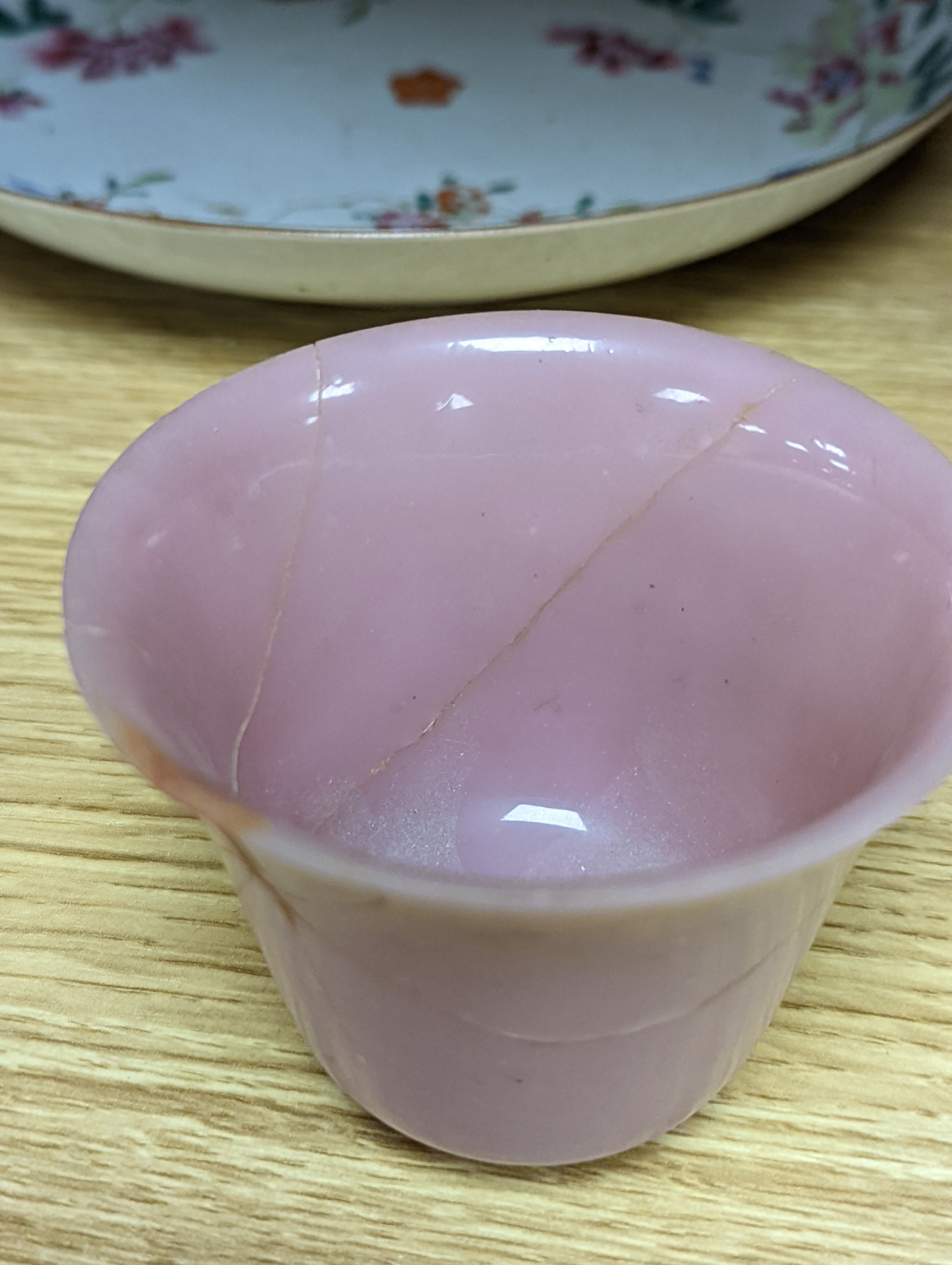 An 18th century Chinese famille rose dish, crackle-glaze stem cup, Beijing glass tea bowl and a Chinese Imari plate. Largest 24cm